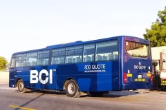 Printzone Advertising LLC vehicle branding company in Dubai Al Quoz wrapping a commercial bus with full vinyl wrap