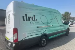 Printzone Advertising LLC vehicle branding company in Dubai Al Quoz wrapping a commercial van with full vinyl wrap