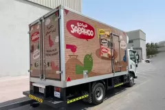 Printzone Advertising LLC vehicle branding company in Dubai Al Quoz wrapping a commercial truck with full vinyl wrap