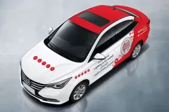 Printzone Advertising LLC vehicle branding company in Dubai Al Quoz wrapping a commercial car with full vinyl wrap