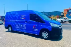 Printzone Advertising LLC vehicle branding company in Dubai Al Quoz wrapping a commercial van with full vinyl wrap