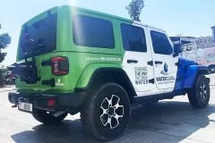 Printzone Advertising LLC vehicle branding company in Dubai Al Quoz wrapping a commercial vehicle with full vinyl wrap