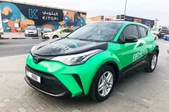 Printzone Advertising LLC vehicle branding company in Dubai Al Quoz wrapping a commercial car with full vinyl wrap