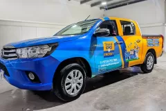 Printzone Advertising LLC vehicle branding company in Dubai Al Quoz wrapping a commercial vehicle with full vinyl wrap