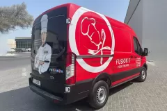 Printzone Advertising LLC vehicle branding company in Dubai Al Quoz wrapping a commercial van with full vinyl wrap