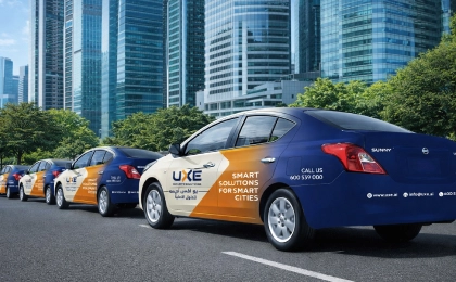 Vehicle branding fleet in Dubai with multiple company vehicles wrapped consistently for corporate identity by Printzone Advertising in Dubai