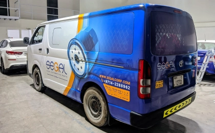 Vehicle branding van wrap in Dubai with high-impact advertising graphics for business promotion by Printzone Advertising in Dubai