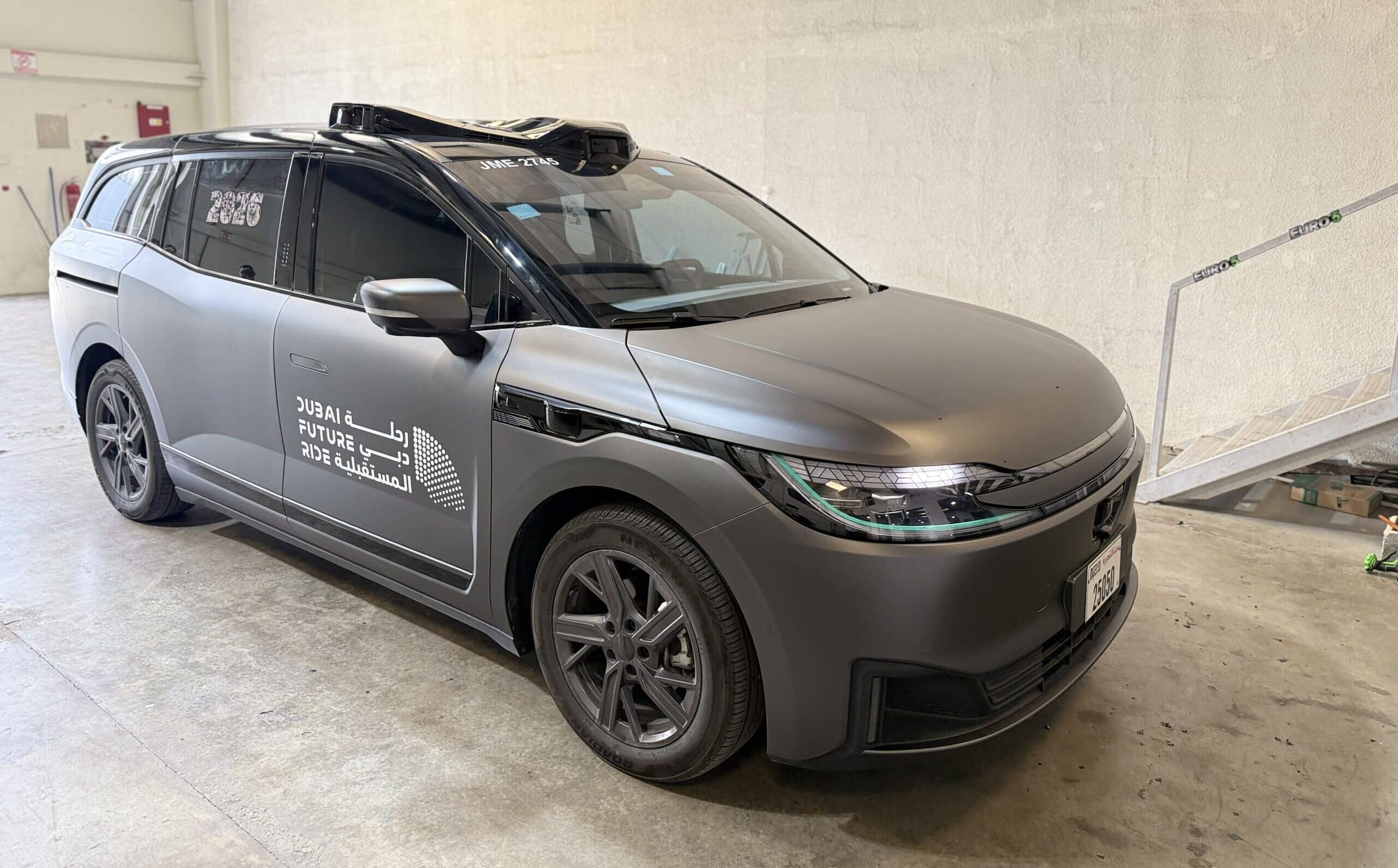 Printzone Advertising LLC - Vehicle branding company in Dubai wrapping a commercial car van with full vinyl wrap - 2