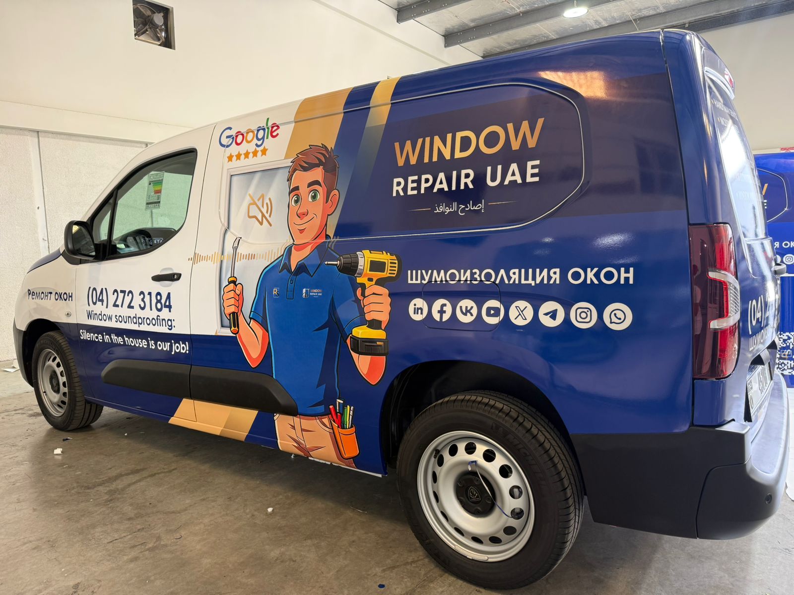 Vehicle branding team applying custom vinyl wrap to a branded vehicle, professional car branding services by Printzone Advertising LLC Inhouse - 1